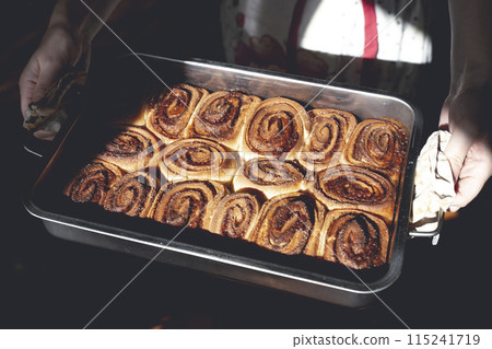 Cinnamon bun roll in plate. Homemade Oven bakery desert for breakfast Cinnamon bun roll in plate. Homemade Oven bakery desert for breakfast 115241719