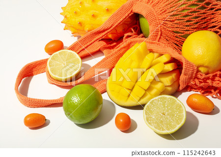 Set of tropical fruit in bag on white background, close up Set of tropical fruit in bag on white background, close up 115242643
