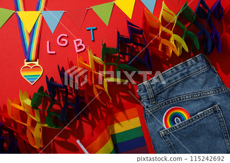 LGBT parade concept, colorful symbols on red background. LGBT parade concept, colorful symbols on red background. 115242692