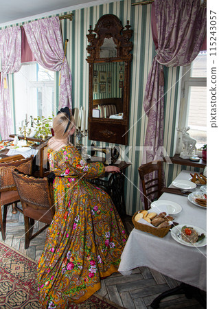 Portrait of a beautiful Russian girl in a kokoshnik and traditional dress Portrait of a beautiful Russian girl in a kokoshnik and traditional dress 115243057