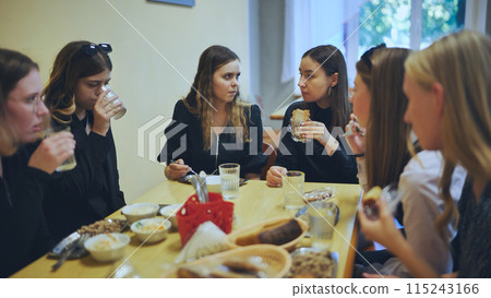High school students eat in the cafeteria. High school students eat in the cafeteria. 115243166