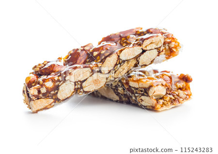 Close Up of almond Brittle Bars With Caramelized Coating isolated on white background. 115243283