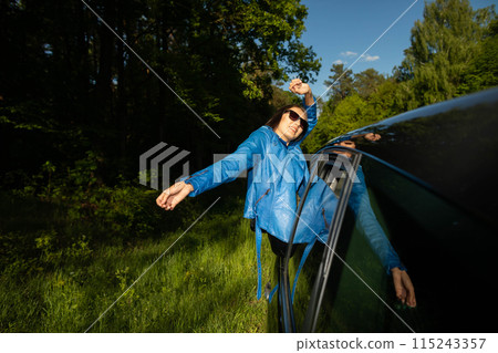 A stopover in the forest on the side of the road during long journeys by passenger car for a dream vacation. A stopover in the forest on the side of the road during long journeys by passenger car for a dream vacation. 115243357