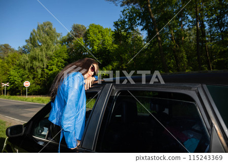 A stopover in the forest on the side of the road during long journeys by passenger car for a dream vacation. A stopover in the forest on the side of the road during long journeys by passenger car for a dream vacation. 115243369