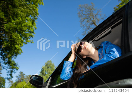 A stopover in the forest on the side of the road during long journeys by passenger car for a dream vacation. A stopover in the forest on the side of the road during long journeys by passenger car for a dream vacation. 115243404