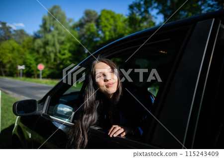 A stopover in the forest on the side of the road during long journeys by passenger car for a dream vacation. 115243409