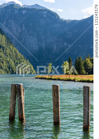 Bollards at the Pier Saint Bartholomew at Lake Koenigssee in Bavaria Bollards at the Pier Saint Bartholomew at Lake Koenigssee in Bavaria 115243579