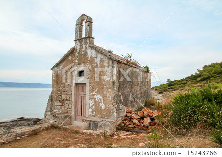 Beautiful little abandoned chapel at the coast of Hvar island 115243766