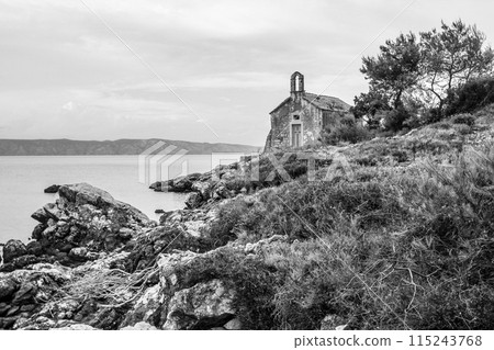 Beautiful little abandoned chapel at the coast of Hvar island 115243768