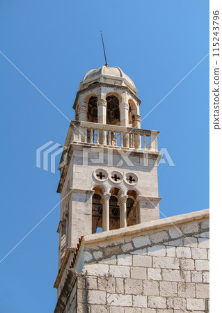 Picturesque classic bell tower of a church in Hvar Picturesque classic bell tower of a church in Hvar 115243796