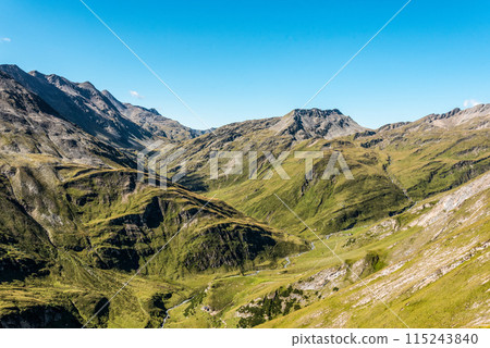 Scenic alpine landscape in the High Tauern National Park during a hike around Mt. Grossglockner Scenic alpine landscape in the High Tauern National Park during a hike around Mt. Grossglockner 115243840