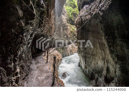 Hiking through the scenic Partnach gorge near Garmisch-Partenkirchen in the Bavarian Alps Hiking through the scenic Partnach gorge near Garmisch-Partenkirchen in the Bavarian Alps 115244008