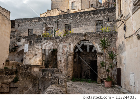 Ancient medieval alleyway somewhere in the historic town of Matera, Southern Italy 115244035