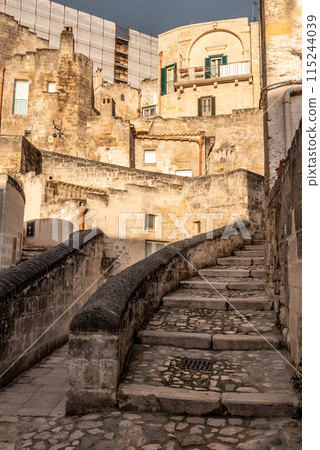Abandoned alley with staircase in the historic downtown of Matera, Southern Italy 115244039