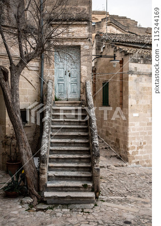 Abandoned staircase leading to a closed door in the typical Italian town of Matera, Southern Italy Abandoned staircase leading to a closed door in the typical Italian town of Matera, Southern Italy 115244169