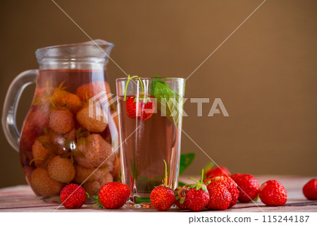Sweet refreshing berry compote of ripe strawberries in a decanter Sweet refreshing berry compote of ripe strawberries in a decanter 115244187