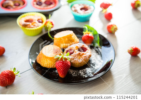 Sweet curd muffins with strawberry filling 115244201