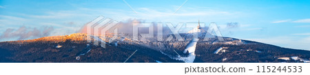 Panoramic view of Jested Mountain in sunny winter evening. Liberec, Czech Republic. 115244533