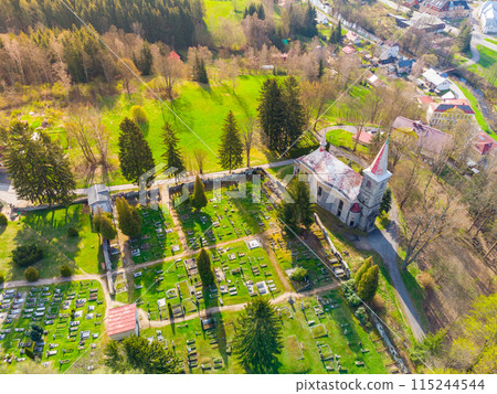 Church of Saint Peter and Paul in Horni Tanvald, Czech Republic . Aerial view from drone. 115244544