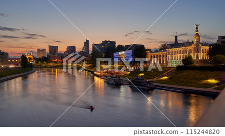 Vilnius night sunset panoramic cityscape with Neris river, church and skyscrapers of New Center. Lithuania, Baltic states. 115244820