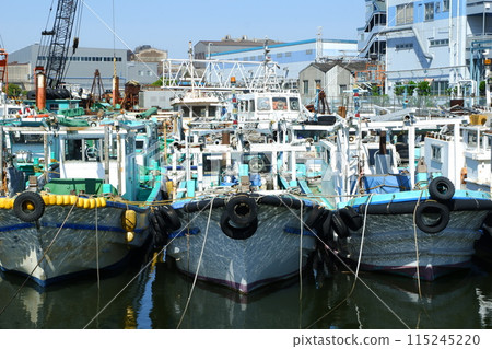 Work boat moored in port Work boat moored in port 115245220