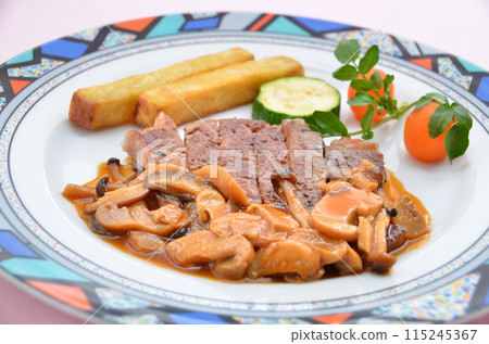 Sirloin steak and mushrooms served with colorful vegetables Sirloin steak and mushrooms served with colorful vegetables 115245367