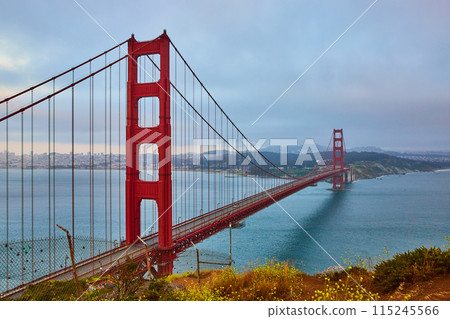 Cloudy and hazy sunset from Golden Gate Bridge overlook with view of bridge and bay Cloudy and hazy sunset from Golden Gate Bridge overlook with view of bridge and bay 115245566