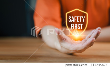 People presenting the safety banner symbol, highlighting a commitment to workplace safety, zero accidents, and fostering a culture of hazard awareness among workers. People presenting the safety banner symbol, highlighting a commitment to workplace safety, zero accidents, and fostering a culture of hazard awareness among workers. 115245825