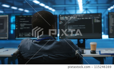 African american person with impairment in server farm ensuring data remains shielded from threats. Close up shot of wheelchair user safeguarding data center hardware against unauthorized access 115246169