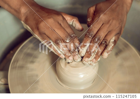 Close up of hands on a pottery wheel Close up of hands on a pottery wheel 115247105
