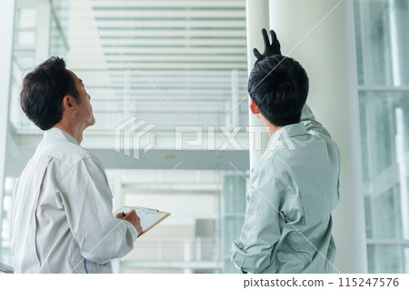 A worker who maintains piping 115247576