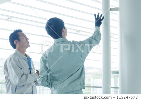 A worker who maintains piping 115247578