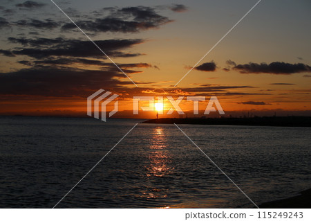 Sunset over the sea and a fisherman 115249243
