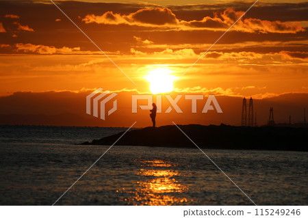 Sunset over the sea and a fisherman Sunset over the sea and a fisherman 115249246