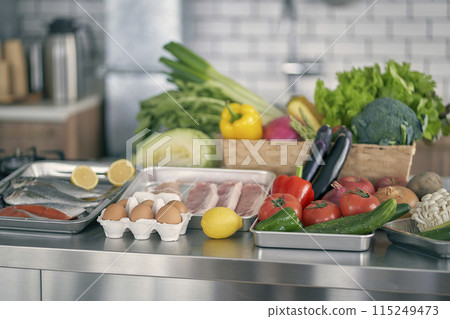 Vegetables lined up in the kitchen 115249473