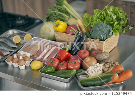 Vegetables lined up in the kitchen 115249474