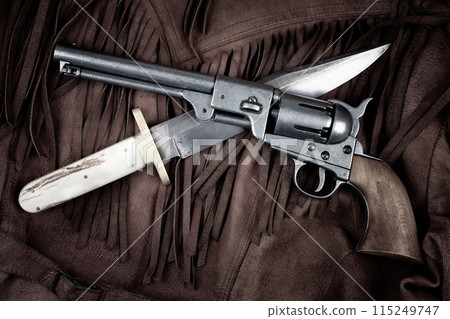 Old West Revolver with bowie knife on leather jacket 115249747