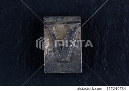 Antique vintage movable type alphabet letter V. 115249784