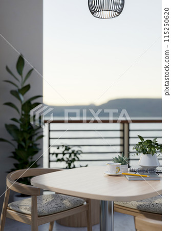 A wooden table with armchairs on a balcony with decorative plants and a beautiful nature view. 115250620