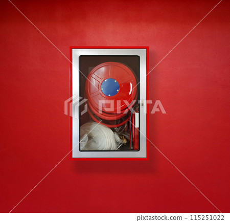 Fire extinguisher for fire protection on red wall Fire extinguisher for fire protection on red wall 115251022