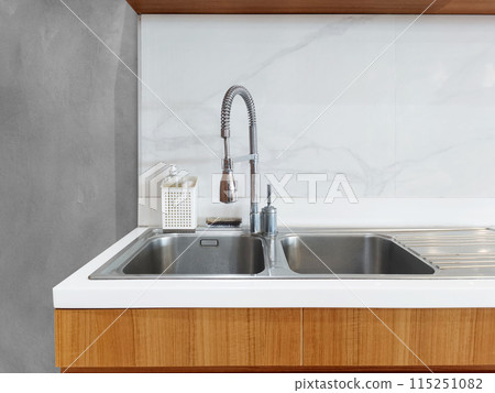 sink For cleaning empty dishes located in the kitchen inside the house. 115251082