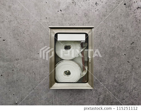 Fire hose cabinet in office building for fire protection preparation Fire hose cabinet in office building for fire protection preparation 115251112