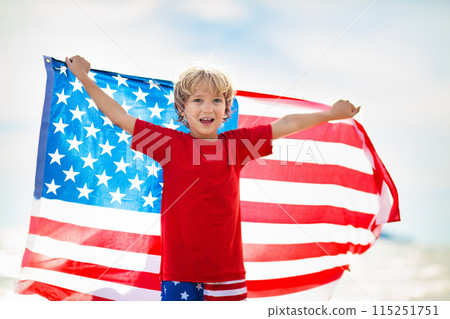 Kids with American flag on beach. 4th of July. 115251751