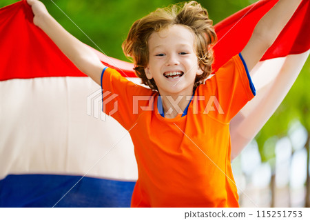 Netherlands team supporter. Dutch kid with flag. 115251753