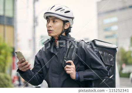 Cheerful delivery person 115252341