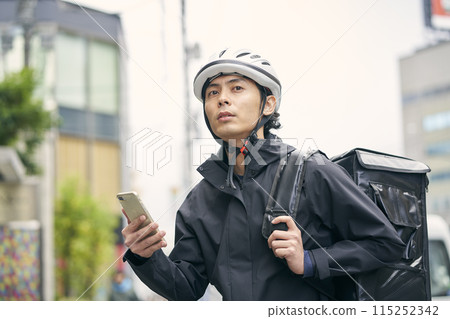 Cheerful delivery person 115252342