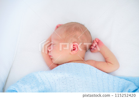 Little baby on white bed Little baby on white bed 115252420