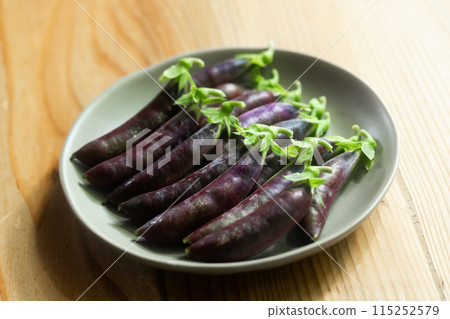 Purple snap peas 115252579