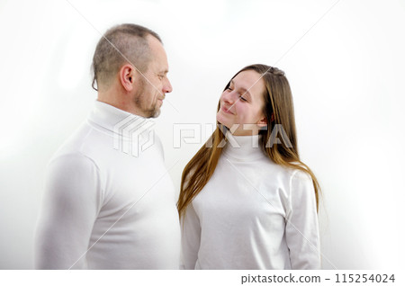 The couple cuddles on a white background. Lovers 115254024