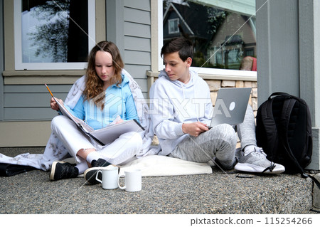 new creative ideas of youth boys girl communicate on porch come up with plans laptop in a folder white cups tracksuits private sector Canada America Europe backpack attitude smile friends adolescence 115254266